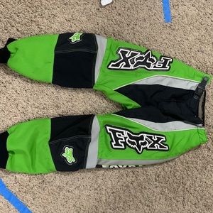 A Pair of a black white fox brand dirt bike pants size 22 kids